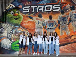 HCU fine arts students working on Astros mural