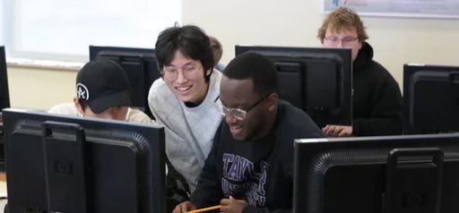 Taylor University students playing together at computers in the Taylor Esports Club
